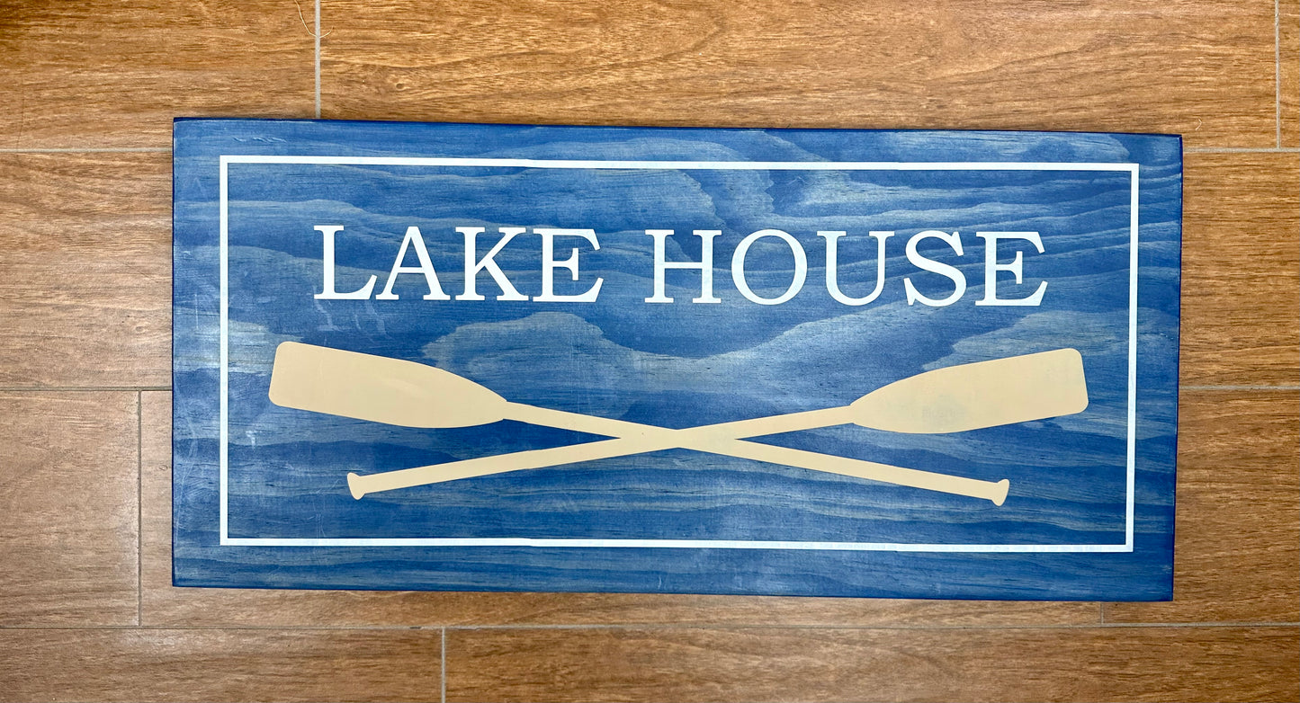 222-Lake House with two large crossed paddles